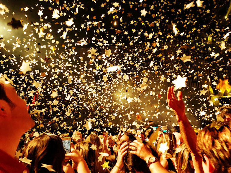 A wall of raised phones filming a crowd